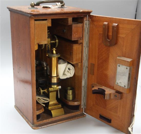 A Leitz Wetzlar brass microscope, in original case with accessories